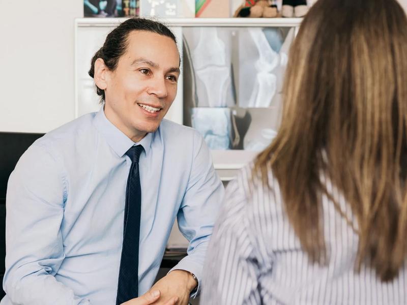 Dr. Oliver Khoo examining x-rays